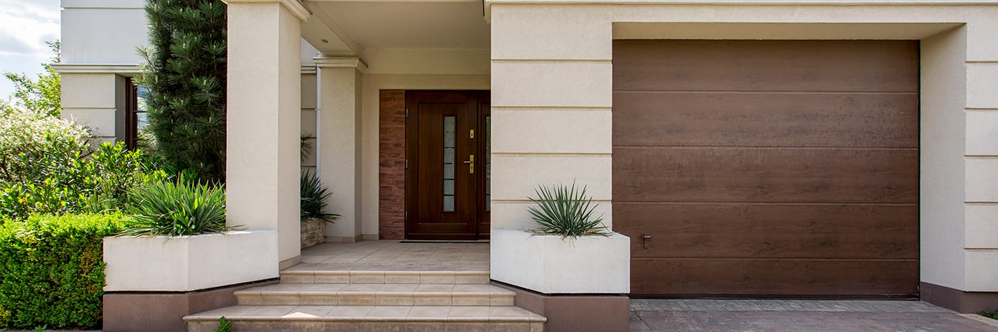 Beautiful home with wood garage door
